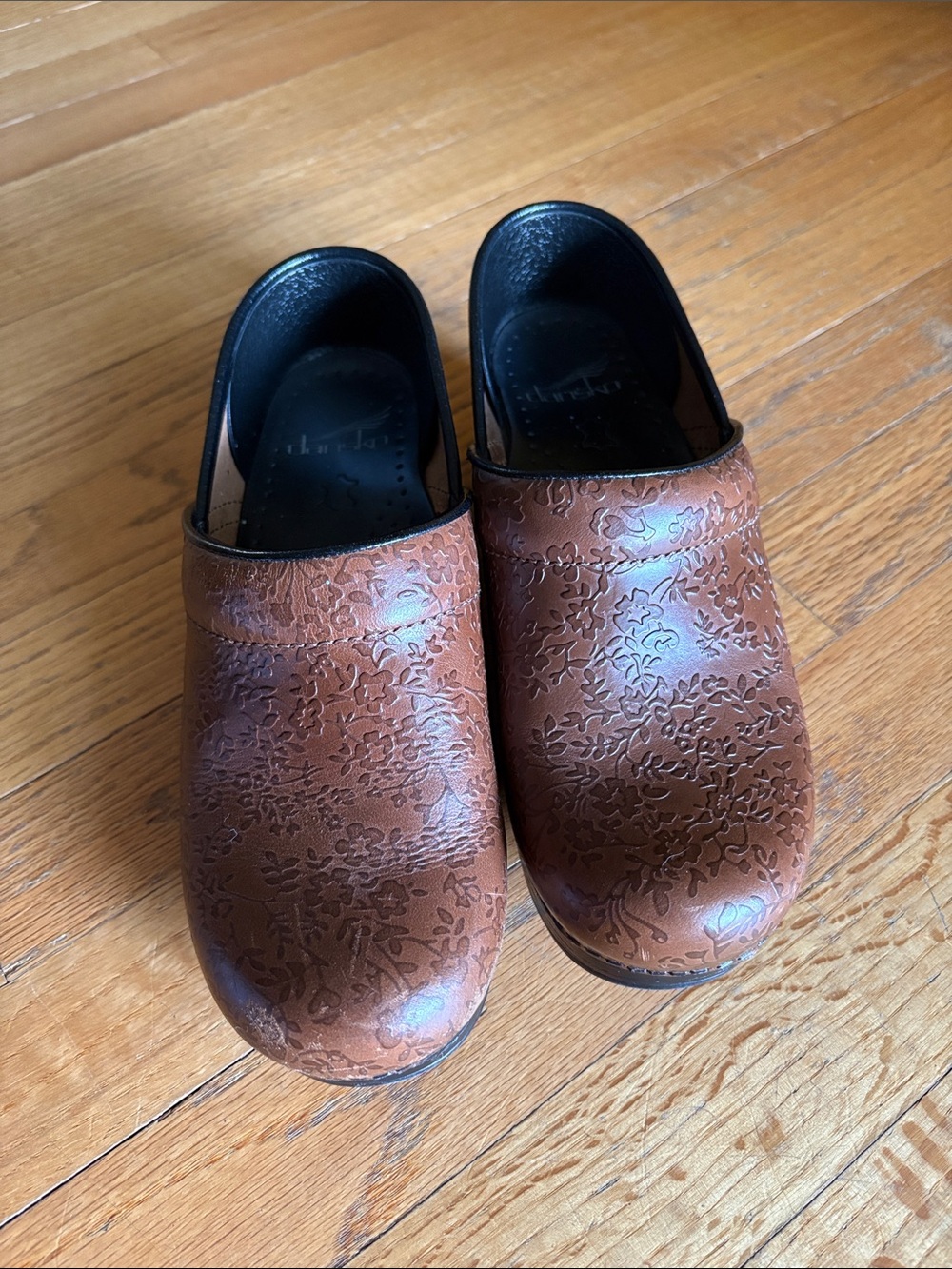 Dansko brown floral leather clogs